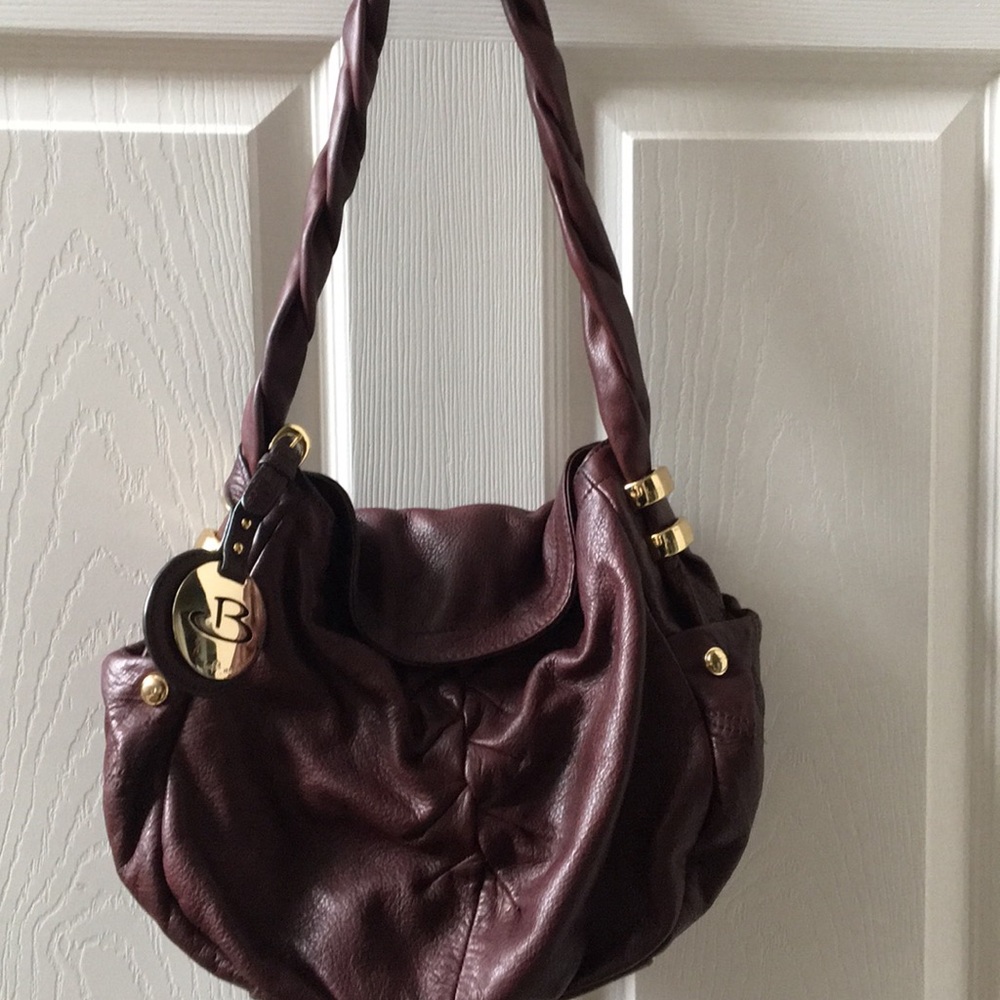 B. Makowsky Purse. Brown-maroonish color.